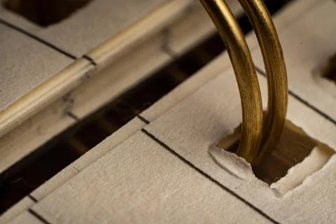 Close-up view of a binder mechanism with silver rings securing empty paper Stock Photos