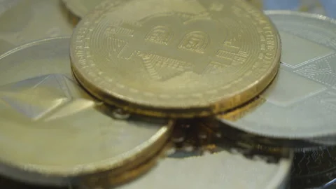 Close-up view of Bitcoin and cryptocoins. Stock Footage 246388037