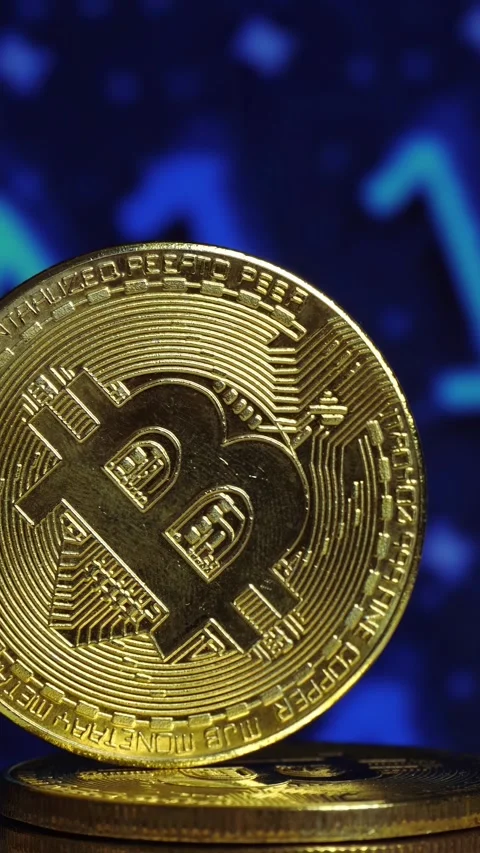 Close-up view of bitcoin coins in vertical arrangement. Cryptocurrency Stock Footage 348573876