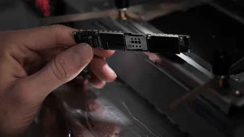 Close view black and white iphone motherboard in hand Stock Footage 104655728