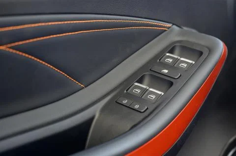 Close up view of black control panel on door of modern car. Stock Photos