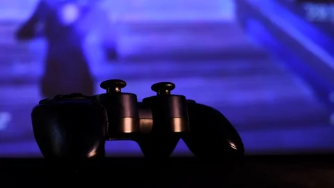 Close-up view black controller on table to play video games on game console. Stock Footage 130055473