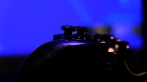 Close-up view black controller on table to play video games on game console. Stock Footage 130055478