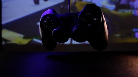 Close-up view black controller on table to play video games on game console. Stock Footage 130055493