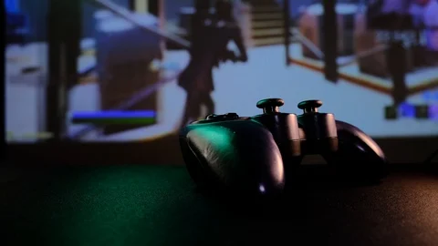 Close-up view black controller on table to play video games on game console. Stock Footage 130055512