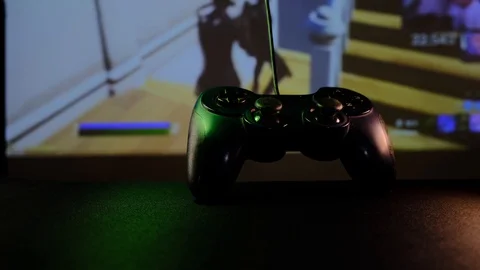 Close-up view black controller on table to play video games on game console. Stock Footage 130055515