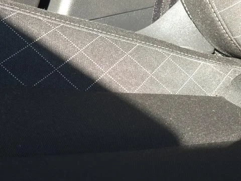 Close-up view of black fabric texture featuring a checkered pattern. Suitable 스톡 사진