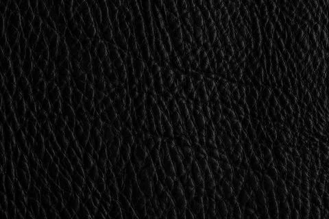 Close up view of black leather surface showing texture and design details i.. Stock Photos