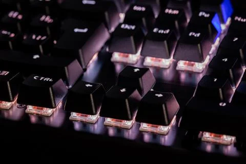 A close-up view of black mechanical pc keyboard with white backlight Stock Photos