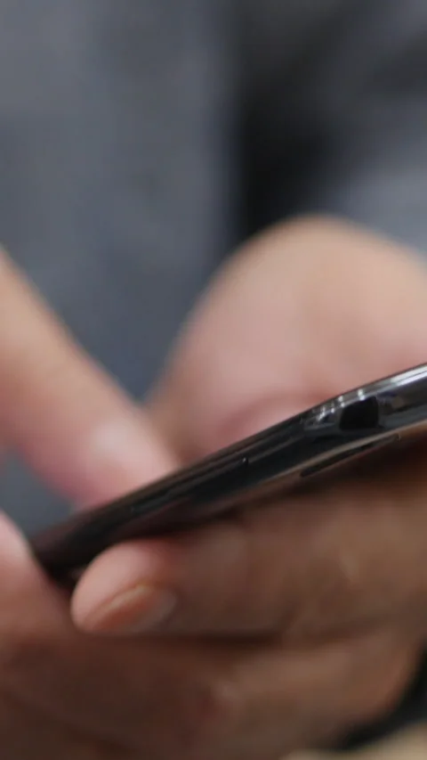 Close View Of A Black Phone Being Used By Hand. Vertical. Stock Footage 296896810