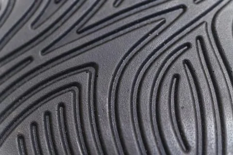 Close-up view of black rubber shoe sole pattern 库存照片