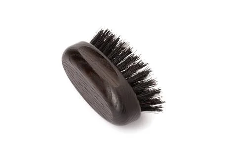 Close up view of a black wood beard brush with natural bristles Stock Photos