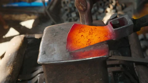Close-up view of Blacksmith forges red-hot metal. Stock Footage 209646591