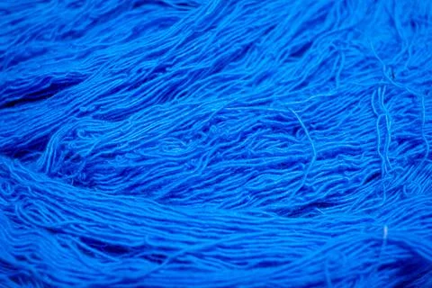 Close view of the blue color thread yarns used in textile industry Stock Photos