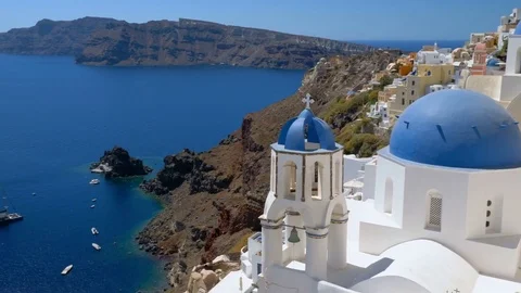 Close up view of blue dome churches on the steep cliff in Santorini Island Stock Footage 82687231