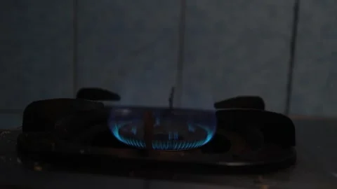 Close Up View of Blue Fire Flame Burning on a Gas Stove Burner Ring Stock Footage 346443356