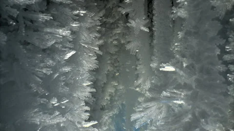 Close-up view of blue ice crystals in a frozen cave, smooth slider movement Video stock 309608099