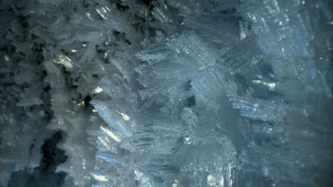 Close-up view of blue ice crystals in a frozen cave, smooth slider movement Stock Footage 309608769