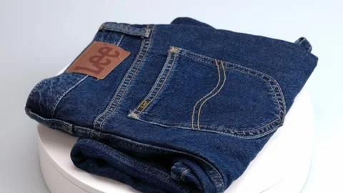Close-up view of blue LEE denim skirt on rotating disc. Stock Footage 251438679