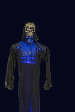 Close up view of blue lighted skeleton head on black background. Stock Photos
