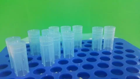 Close up view of blue micro litre tips in microtip box with empty holes. Rese Stock Photos