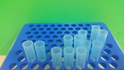 Close up view of blue micro litre tips in microtip box with empty holes. Rese Stock Photos