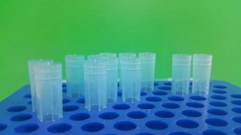 Close up view of blue micro litre tips in microtip box with empty holes. Rese Stock Photos