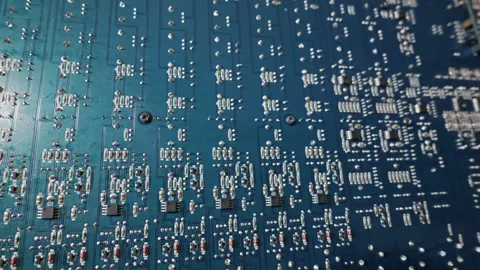 Close Up View of Blue Printed Circuit Board with Microchips and Resistors Stock Footage 333819686