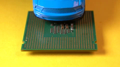 Close up view of a blue toy car on top of a microprocessor. Stock Footage 161120194