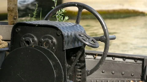 Close up view of a boat steering wheel anchored by the riverside of Seine, Paris Stock Footage 56839918