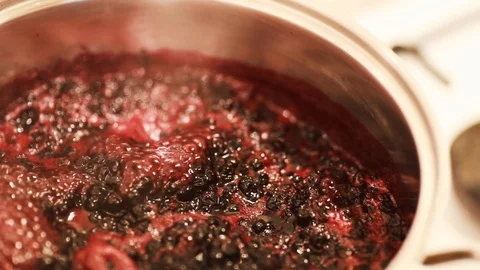 Close-up view of boiling blueberries. Stock Footage 112062223