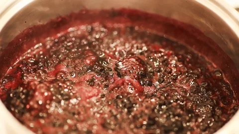 Close-up view of boiling blueberries. Stock Footage 112062347