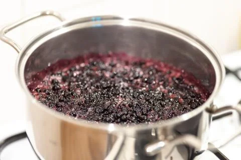 Close-up view of boiling blueberries. Stock-Fotos