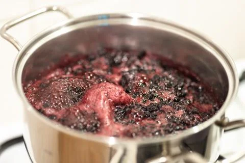 Close-up view of boiling blueberries. Stock-Fotos