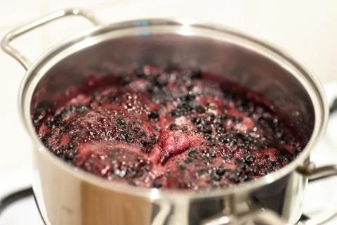 Close-up view of boiling blueberries. Stock-Fotos