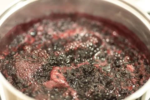 Close-up view of boiling blueberries. Stock-Fotos