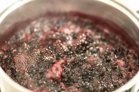Close-up view of boiling blueberries. Stock-Fotos