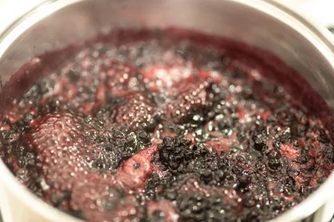Close-up view of boiling blueberries. Stock-Fotos