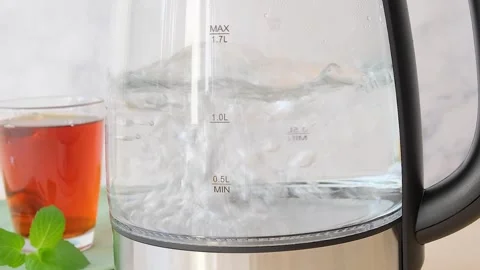 Close up view of boiling water boiling water in a transparent dish  Stock Footage 282655114