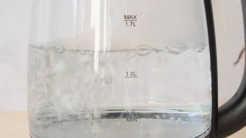 Close up view of boiling water boiling water in a transparent dish  Stock Footage 282655117