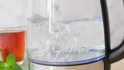 Close up view of boiling water boiling water in a transparent dish  Stock Footage 282655119