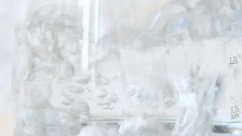 Close up view of boiling water boiling water in a transparent dish or in a glass Stock Footage 282655129