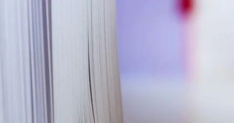 Close up view of book with pages flipping slowly. Stock Footage 255993427