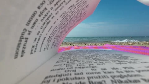 Close up View: From Book Pages looking to Sea Waves Stock Footage 250468414