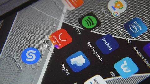 Close-up view of Booking.com icon app on an Android smartphone, including other  Stock Footage 128378620