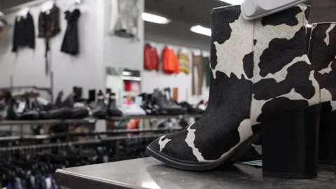 Close up view of boots on display in a clothes store Stock Footage 296220206