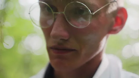 Close View of Botany Student Observing with Microscope in Forest Stock Footage 321110239