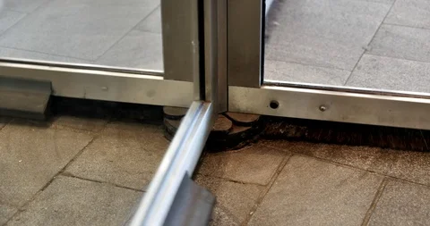 Close up view at the bottom part of moving automatic revolving door Stock Footage 116271674