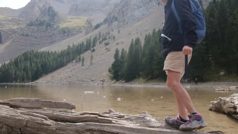 Close up view of boy walking on tree log Vídeos de archivo 252845404