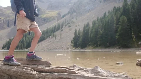Close up view of boy walking on tree log Vídeos de archivo 252846932
